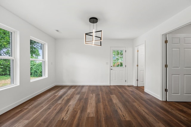 706 Mars St, Murfreesboro, TN 37130 - unfurnished dining area featuring healthy amount of natural light, dark wood-style floors, and a chandelier