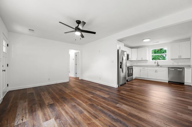 706 Mars St, Murfreesboro, TN 37130 - kitchen featuring stainless steel appliances, open floor plan, a ceiling fan, dark wood-type flooring, and white cabinets