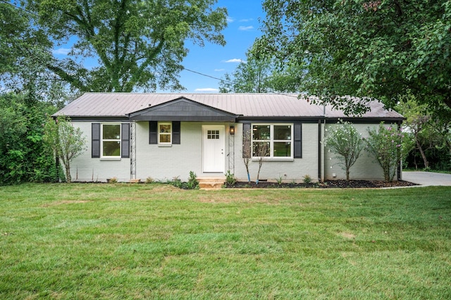 706 Mars St, Murfreesboro, TN 37130 - ranch-style house with brick siding, a front lawn, and a metal roof