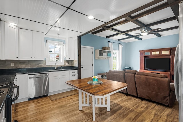 1786 Rocky Glade Rd, Eagleville, TN 37060 - kitchen with stainless steel dishwasher, dark countertops, healthy amount of natural light, light wood-type flooring, and coffered ceiling