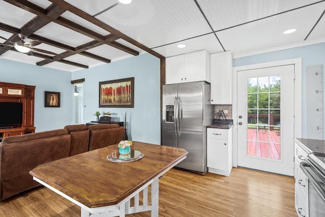 1786 Rocky Glade Rd, Eagleville, TN 37060 - kitchen with stainless steel refrigerator with ice dispenser, stove, coffered ceiling, dark countertops, and white cabinets