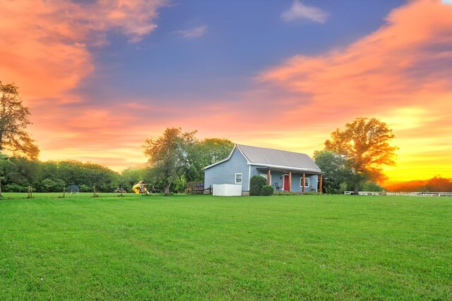1786 Rocky Glade Rd, Eagleville, TN 37060 - view of front of property with a lawn, a metal roof, and a porch