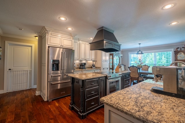 130 Fairway Cir, Loretto, TN 38469 - kitchen with appliances with stainless steel finishes, island exhaust hood, crown molding, light stone counters, and dark wood-style floors
