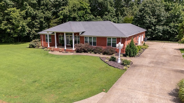130 Fairway Cir, Loretto, TN 38469 - ranch-style home with a garage, concrete driveway, a front yard, and brick siding