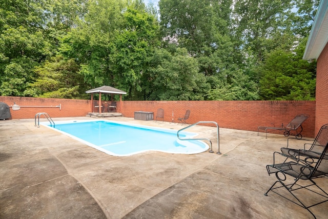 130 Fairway Cir, Loretto, TN 38469 - view of swimming pool with a fenced backyard, a patio area, and view of scattered trees