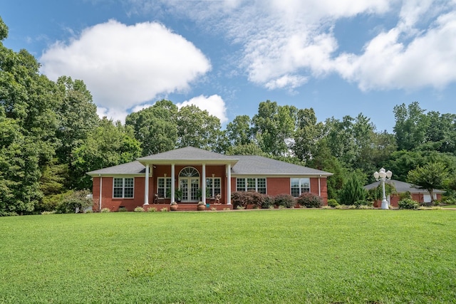 130 Fairway Cir, Loretto, TN 38469 - view of front of house featuring a front lawn, french doors, and brick siding