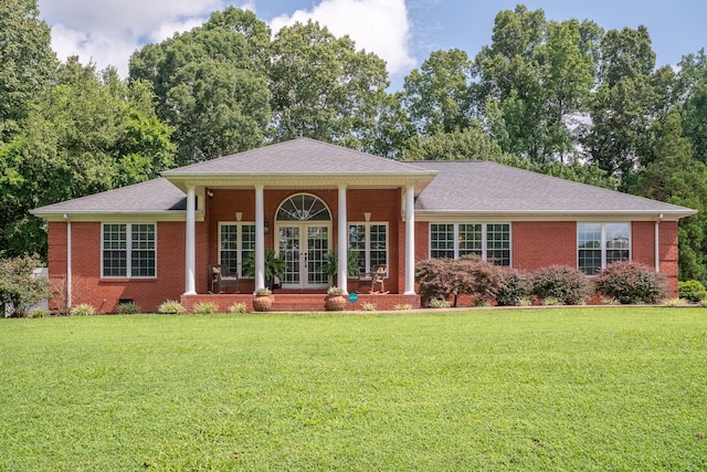 130 Fairway Cir, Loretto, TN 38469 - neoclassical / greek revival house with french doors, a front lawn, and brick siding