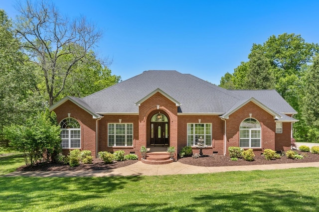 1800 Liberty Ln, Gallatin, TN 37066 - view of front of home with brick siding, a front lawn, and roof with shingles