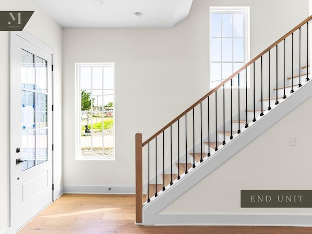 1572 Madison St, Chattanooga, TN 37408 - foyer with plenty of natural light, wood finished floors, and stairway