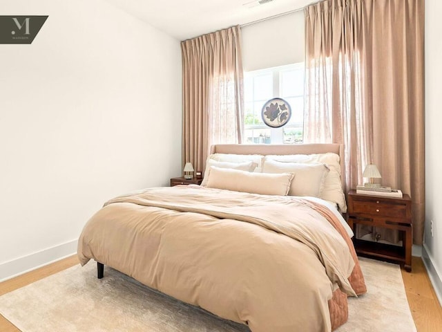 1572 Madison St, Chattanooga, TN 37408 - bedroom featuring light wood-type flooring and baseboards