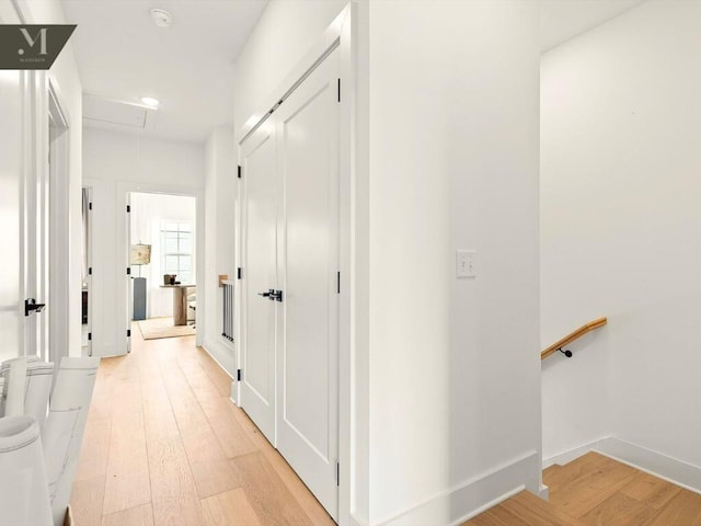 1572 Madison St, Chattanooga, TN 37408 - hallway featuring attic access, light wood-style floors, and an upstairs landing