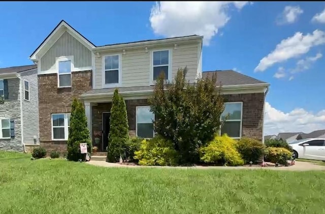 2221 Pearwick Ct, Murfreesboro, TN 37127 - view of front of property featuring a front yard, board and batten siding, and brick siding