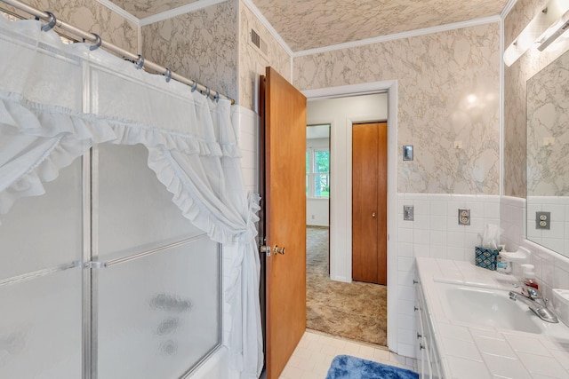 5007 Olivia Dr, Antioch, TN 37013 - bathroom featuring crown molding, vanity, combined bath / shower with glass door, tile patterned flooring, and wallpapered walls