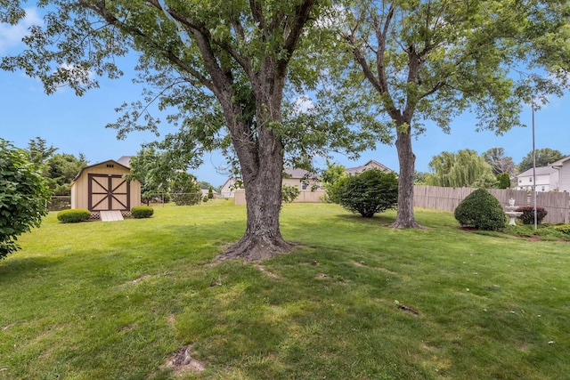 5007 Olivia Dr, Antioch, TN 37013 - fenced backyard featuring a storage unit