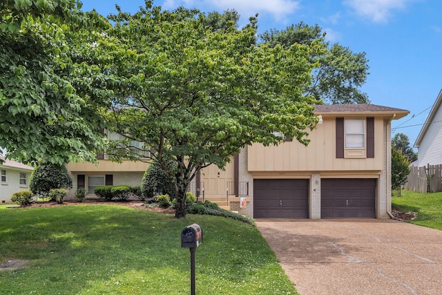 5007 Olivia Dr, Antioch, TN 37013 - view of front of property with brick siding, an attached garage, driveway, and a front lawn