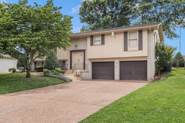 5007 Olivia Dr, Antioch, TN 37013 - bi-level home featuring brick siding, an attached garage, driveway, and a front yard