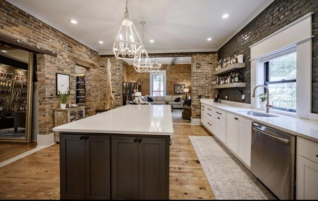 422 N Academy St, Murfreesboro, TN 37130 - kitchen with dishwasher, light countertops, white cabinetry, a chandelier, and decorative light fixtures