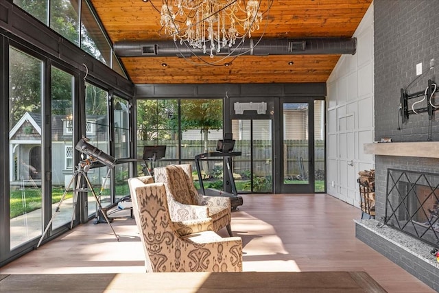 422 N Academy St, Murfreesboro, TN 37130 - sunroom / solarium with wood finished floors, high vaulted ceiling, and a chandelier