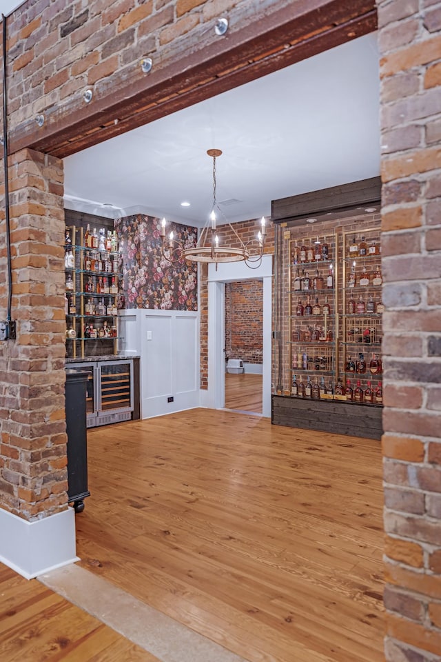 422 N Academy St, Murfreesboro, TN 37130 - indoor dry bar featuring wine cooler, wood finished floors, a wainscoted wall, and a chandelier