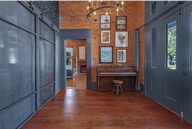422 N Academy St, Murfreesboro, TN 37130 - foyer with hardwood / wood-style flooring, a towering ceiling, a chandelier, and a large fireplace