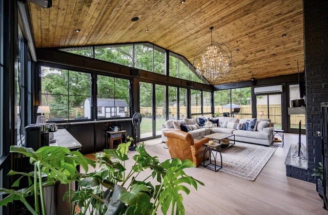 422 N Academy St, Murfreesboro, TN 37130 - sunroom / solarium with wood ceiling, an outdoor living space, high vaulted ceiling, a chandelier, and wood finished floors