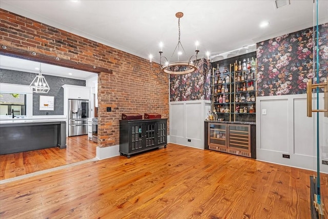 422 N Academy St, Murfreesboro, TN 37130 - wine cellar featuring a chandelier, wine cooler, hardwood / wood-style flooring, wallpapered walls, and a bar