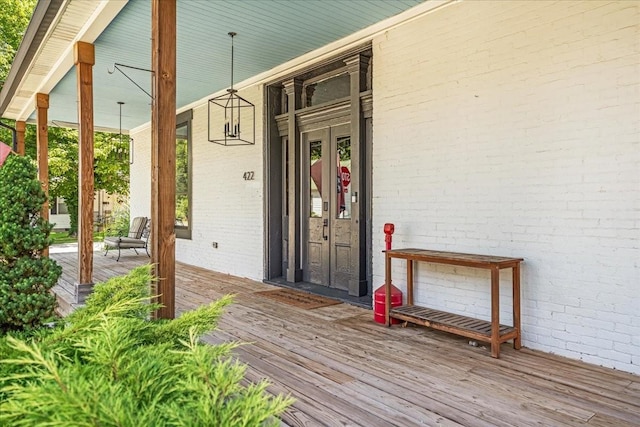 422 N Academy St, Murfreesboro, TN 37130 - doorway to property with a porch, brick siding, and french doors