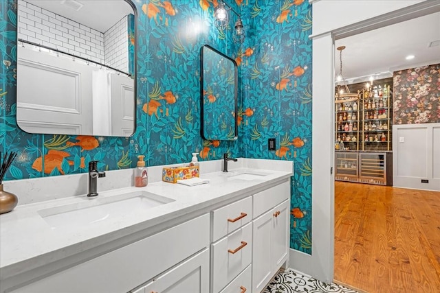 422 N Academy St, Murfreesboro, TN 37130 - full bathroom featuring wallpapered walls, double vanity, and wood finished floors