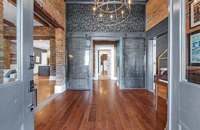 422 N Academy St, Murfreesboro, TN 37130 - entryway with hardwood / wood-style floors, a chandelier, and brick wall