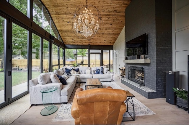 422 N Academy St, Murfreesboro, TN 37130 - sunroom / solarium featuring an outdoor living space with a fireplace, lofted ceiling, plenty of natural light, and a chandelier