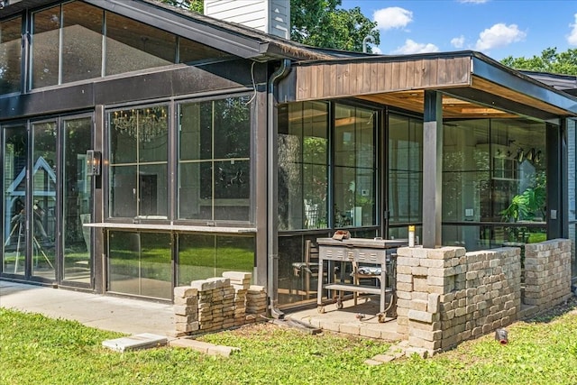 422 N Academy St, Murfreesboro, TN 37130 - view of home's exterior featuring a sunroom and a chimney