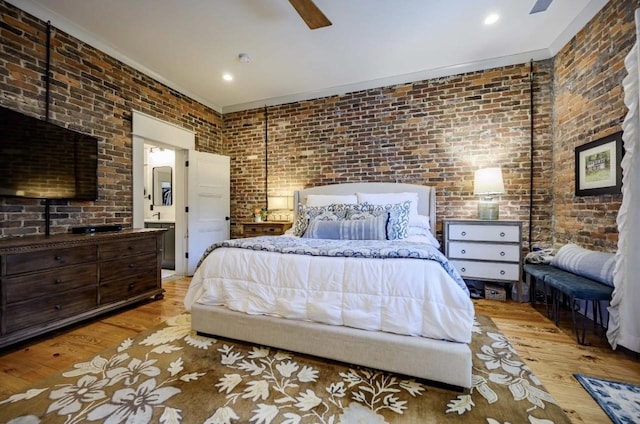 422 N Academy St, Murfreesboro, TN 37130 - bedroom featuring wood finished floors, brick wall, ornamental molding, ceiling fan, and connected bathroom
