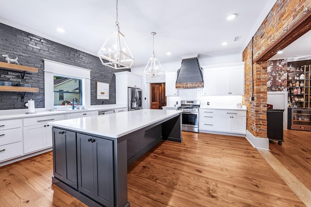 422 N Academy St, Murfreesboro, TN 37130 - kitchen with appliances with stainless steel finishes, custom range hood, a chandelier, a kitchen island, and white cabinetry