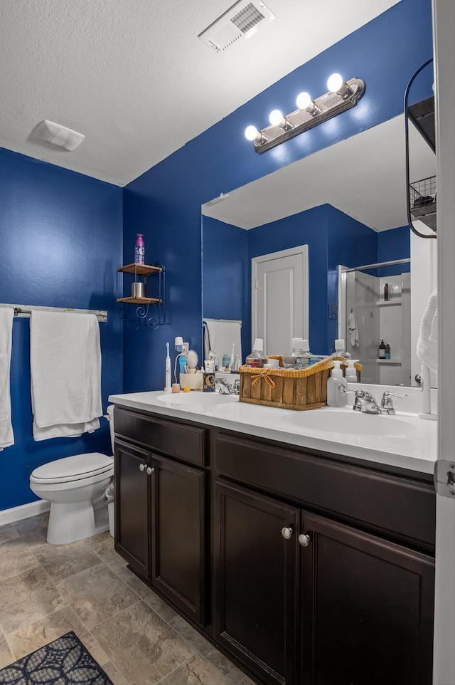 15252 Foamflower Ln, Sale Creek, TN 37373 - bathroom featuring double vanity, a stall shower, and a textured ceiling