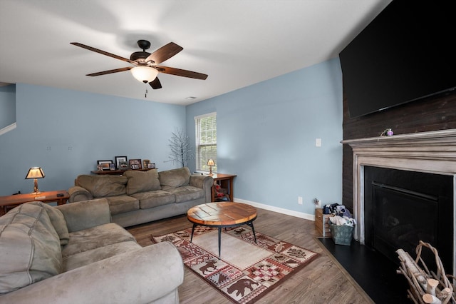 15252 Foamflower Ln, Sale Creek, TN 37373 - living room featuring a ceiling fan, wood finished floors, and a fireplace