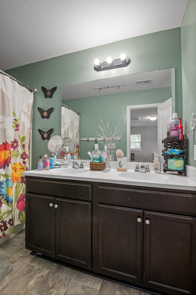 15252 Foamflower Ln, Sale Creek, TN 37373 - bathroom with double vanity, a textured ceiling, and a shower with curtain