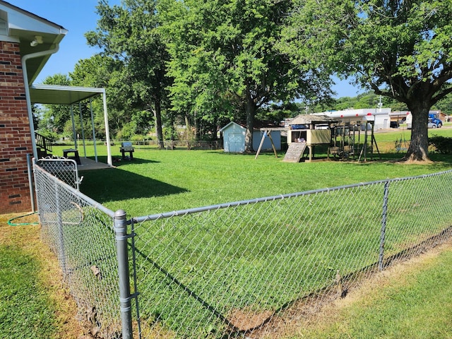 119 Horn Ave, Loretto, TN 38469 - fenced backyard with a playground and a shed