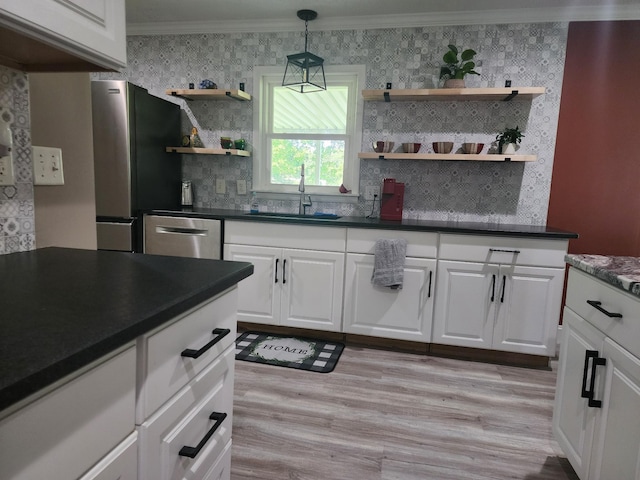 119 Horn Ave, Loretto, TN 38469 - kitchen featuring open shelves, stainless steel appliances, dark countertops, crown molding, and wallpapered walls