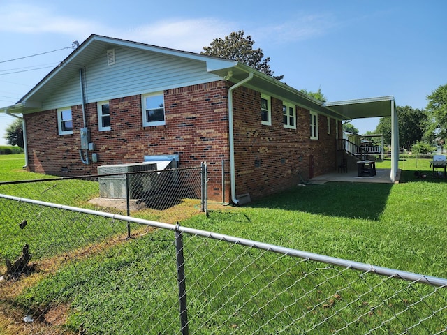 119 Horn Ave, Loretto, TN 38469 - view of property exterior featuring a patio and brick siding