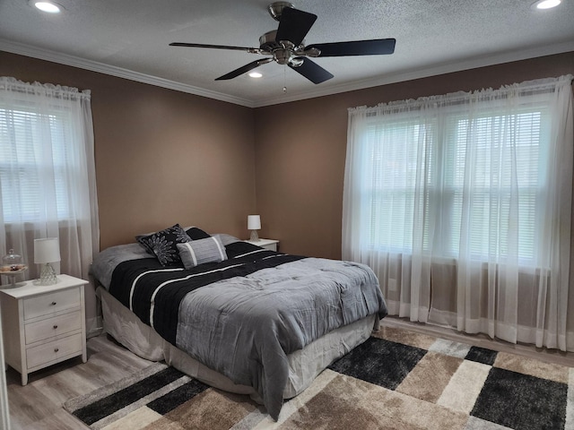 119 Horn Ave, Loretto, TN 38469 - bedroom with multiple windows, light wood finished floors, recessed lighting, crown molding, and ceiling fan
