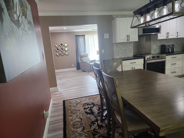 119 Horn Ave, Loretto, TN 38469 - dining area with ornamental molding and light wood-type flooring