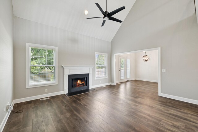 1704 Satterfield Ct, Murfreesboro, TN 37128 - unfurnished living room featuring high vaulted ceiling, a lit fireplace, dark wood-type flooring, ceiling fan, and a chandelier