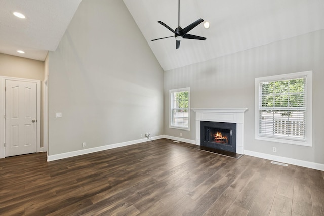1704 Satterfield Ct, Murfreesboro, TN 37128 - unfurnished living room featuring high vaulted ceiling, dark wood finished floors, a lit fireplace, a ceiling fan, and recessed lighting