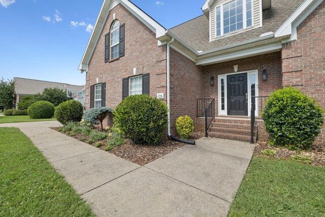 1704 Satterfield Ct, Murfreesboro, TN 37128 - view of front of home featuring brick siding, a shingled roof, and a front yard