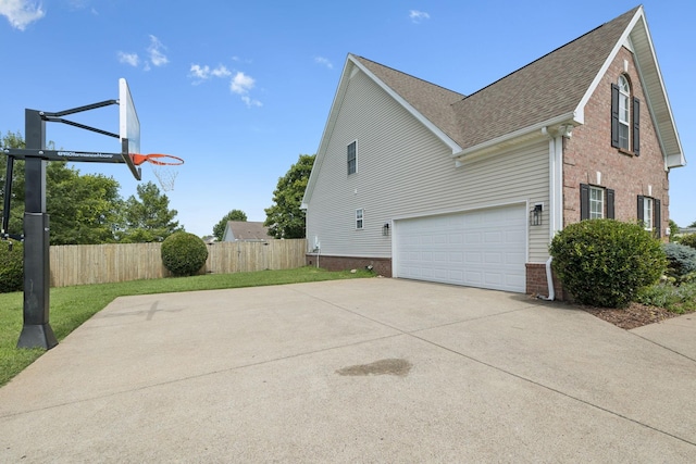 1704 Satterfield Ct, Murfreesboro, TN 37128 - view of side of home with driveway, brick siding, a shingled roof, and a garage