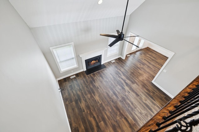 1704 Satterfield Ct, Murfreesboro, TN 37128 - unfurnished living room with a ceiling fan, wood finished floors, a fireplace with flush hearth, and high vaulted ceiling