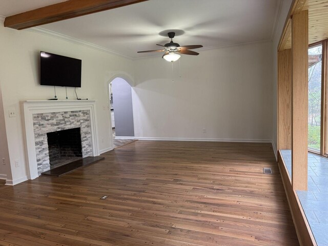 236 N Carolina Ave, Sewanee, TN 37375 - unfurnished living room featuring a ceiling fan, plenty of natural light, a stone fireplace, crown molding, and dark wood-style floors