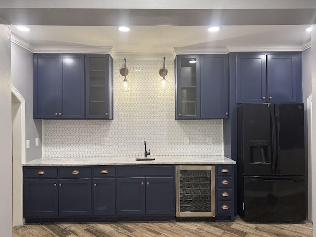 236 N Carolina Ave, Sewanee, TN 37375 - kitchen featuring wine cooler, black refrigerator with ice dispenser, ornamental molding, blue cabinets, and wood finished floors