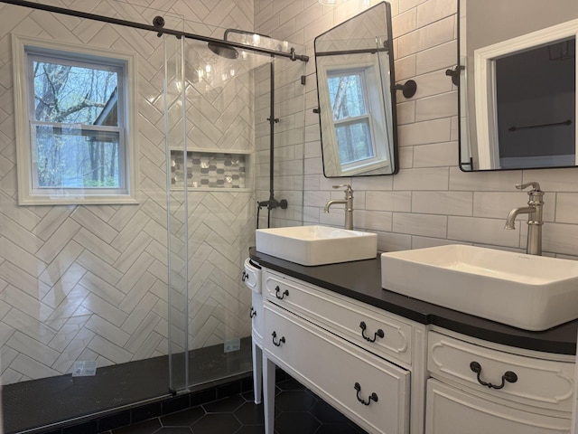 236 N Carolina Ave, Sewanee, TN 37375 - bathroom featuring double vanity, a stall shower, tile walls, tile patterned flooring, and backsplash