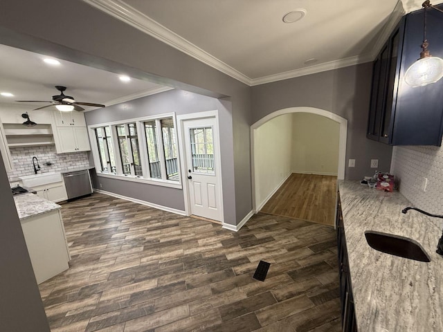 236 N Carolina Ave, Sewanee, TN 37375 - kitchen with stainless steel dishwasher, dark wood-style flooring, tasteful backsplash, ceiling fan, and ornamental molding